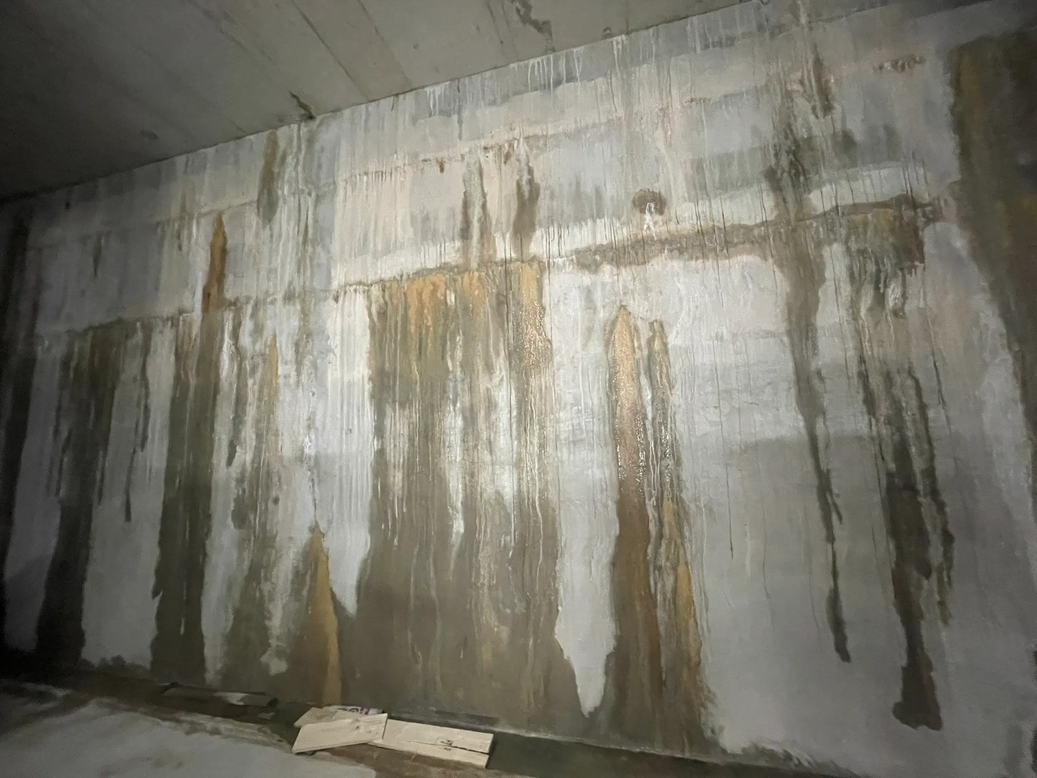 Water staining and leakage down a concrete basement wall
